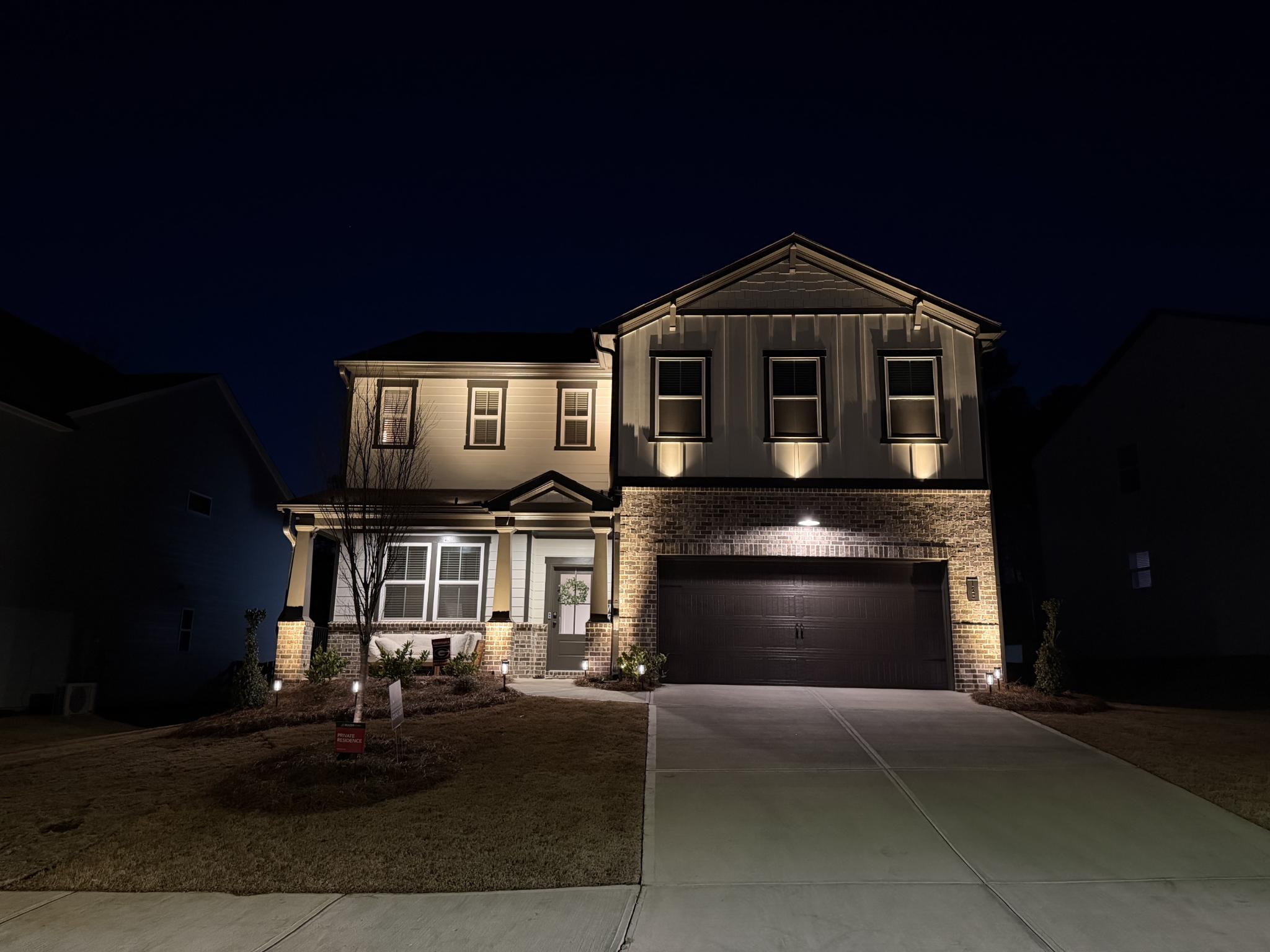 Warm outdoor lighting on stone patio
