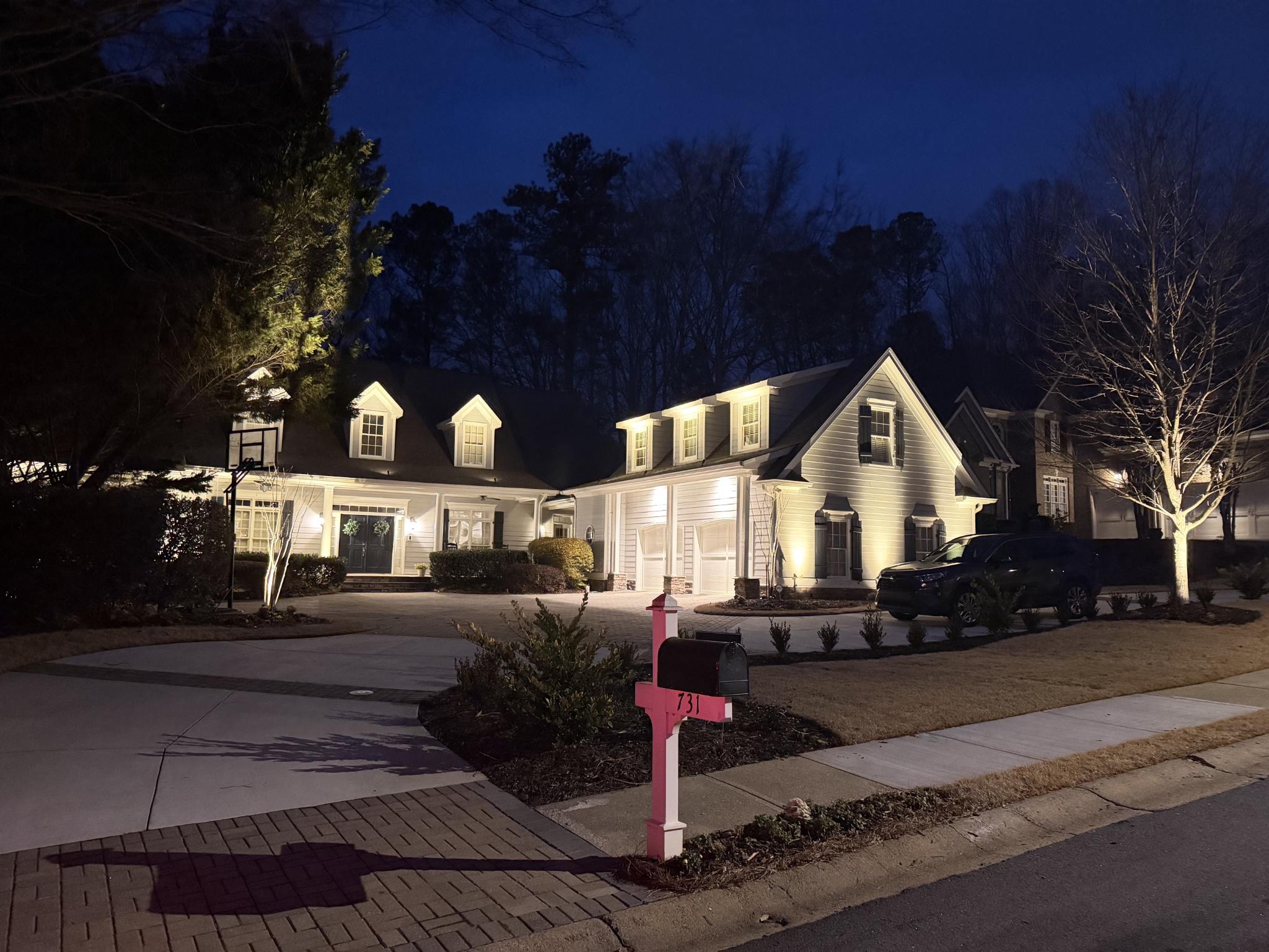 Elegant home with professional landscape lighting